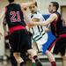 Huron senior Ali Tilawi is defended in the game on Monday, March 4. Daniel Brenner I AnnArbor.com